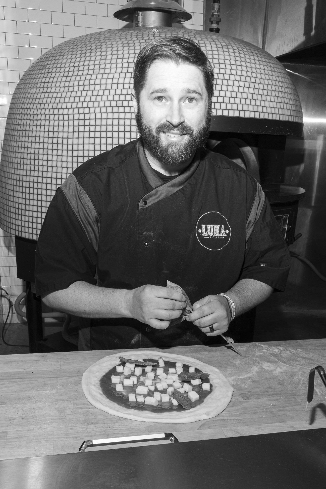 Chef at the pizza oven