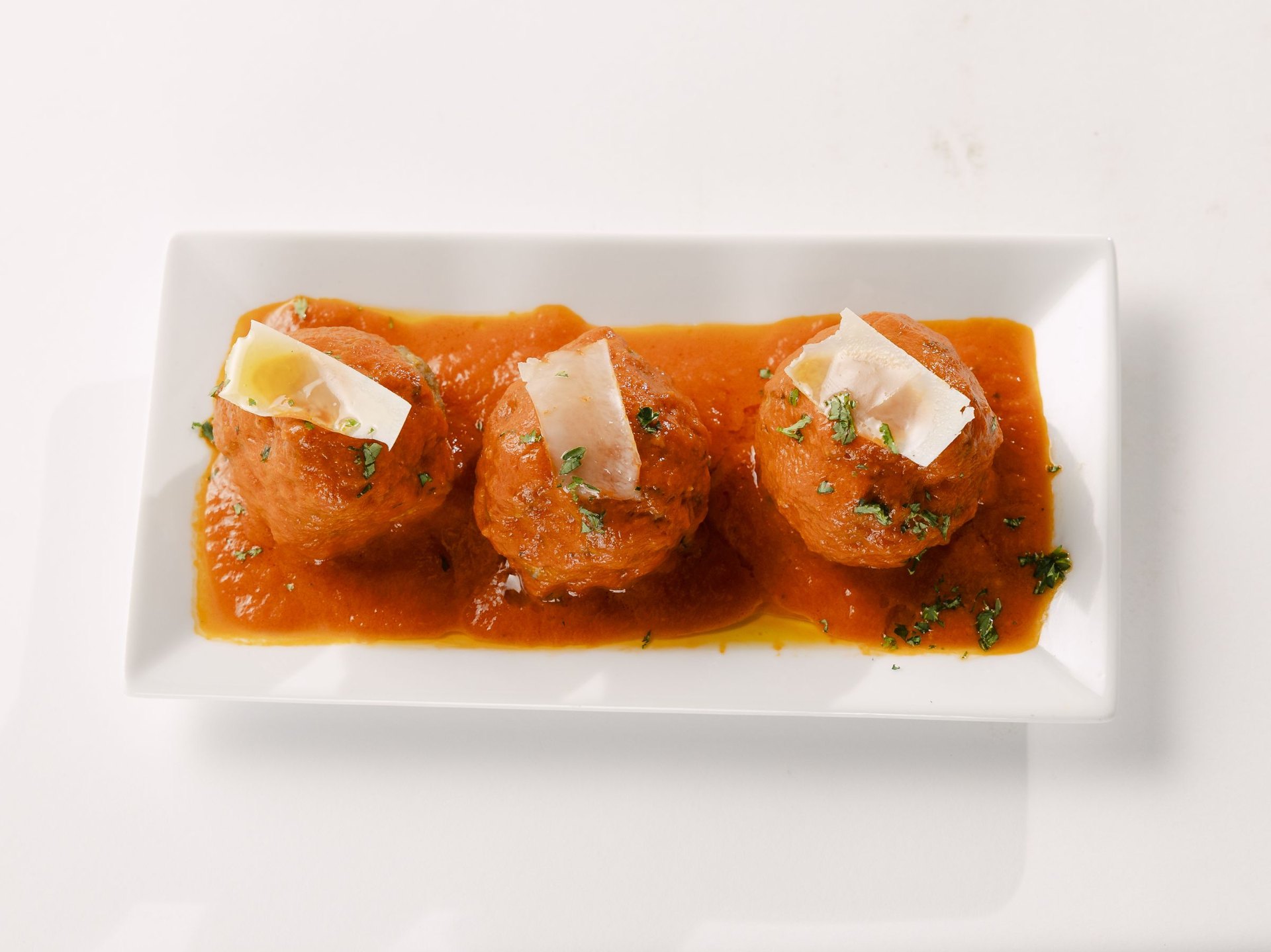 Three meatballs plated